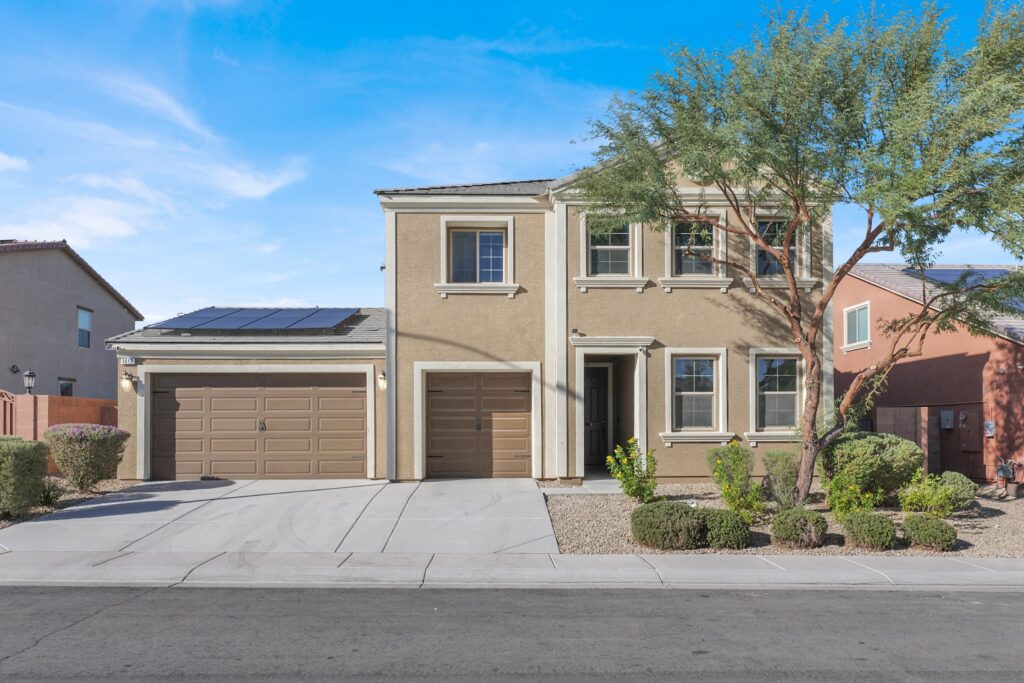 How to pick the right realtor: two-story Las Vegas home with solar panels and desert landscaping